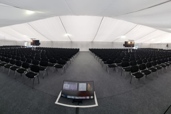 20m x 45m hard sided internal. 1000 seated with white flat lining