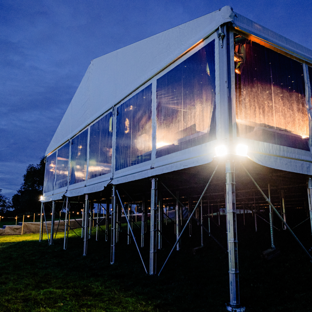 30m premium marquee on cassette floor built into a hill with a bespoke walkway