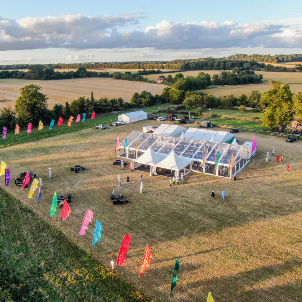 Festival event for corporate client with clear roof, walls and gables plus chinese hats with ancillary marquees for catering and green room