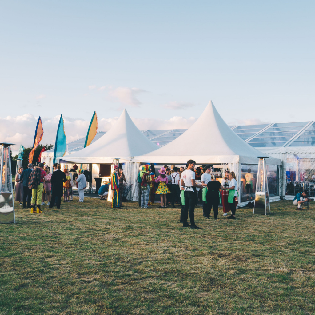 Festival event for corporate client with clear roof, walls and gables plus chinese hats with ancillary marquees for catering and green room